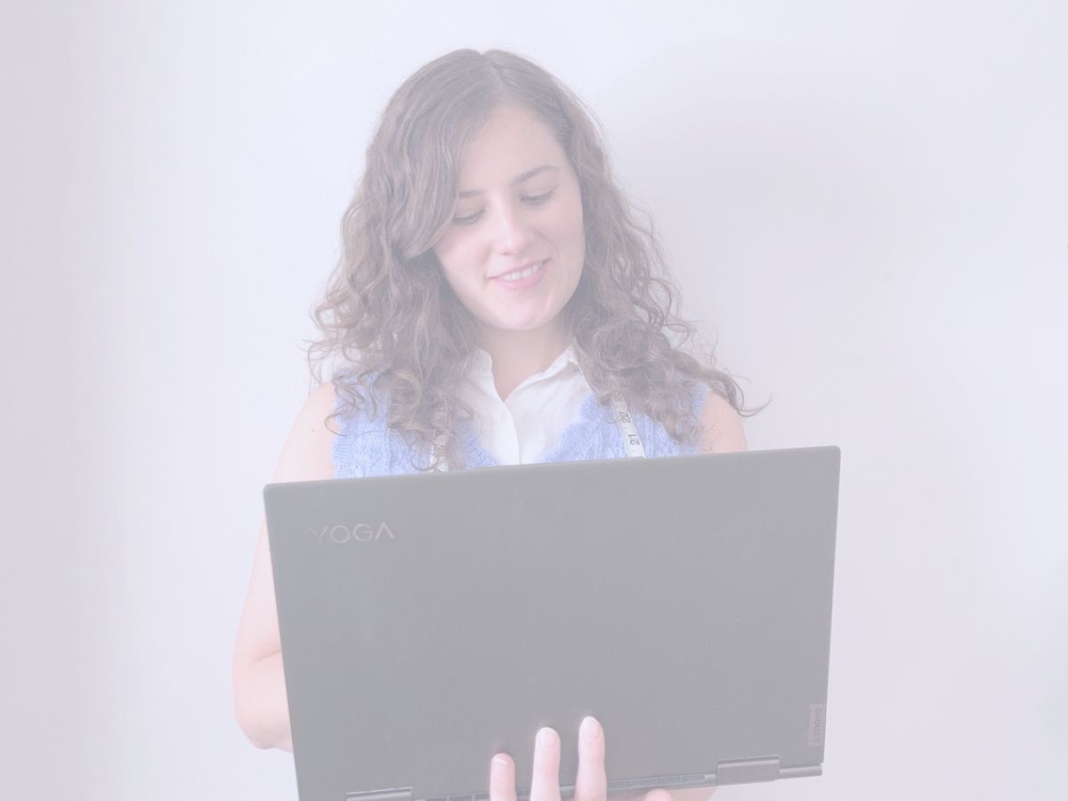 Lingerie and Swimwear Consultant with laptop